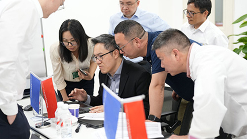 group-of-colleagues-focused-on-laptop