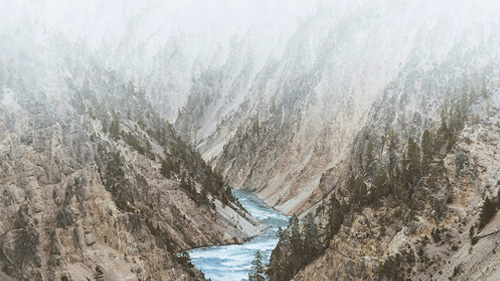 valley-between-snow-covered-mountains